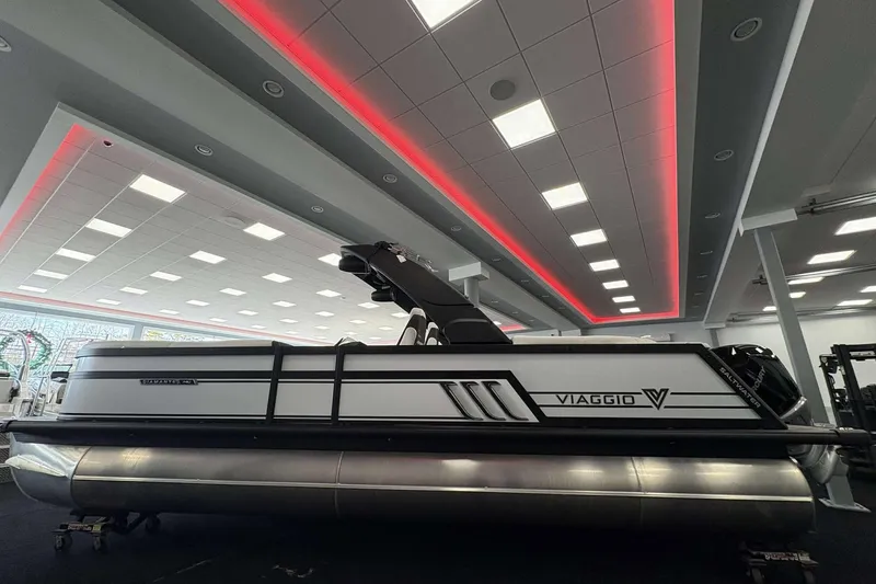 Slide: The Image of 2026 Viaggio D24U pontoon boat displayed indoors with modern lighting. - 3