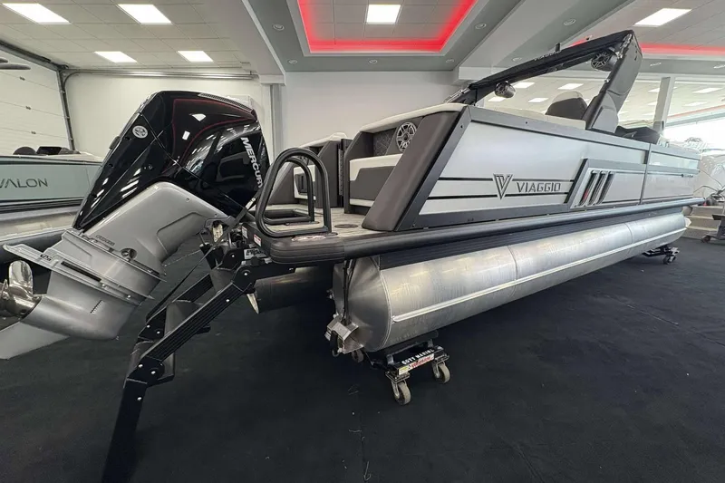 Slide: The Image of 2026 Viaggio D24U pontoon boat with Mercury outboard motor in showroom. - 5