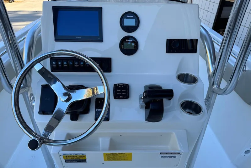 Slide: The Image of Steering console of 2026 Key West 203 FS boat with modern controls and display. - 17