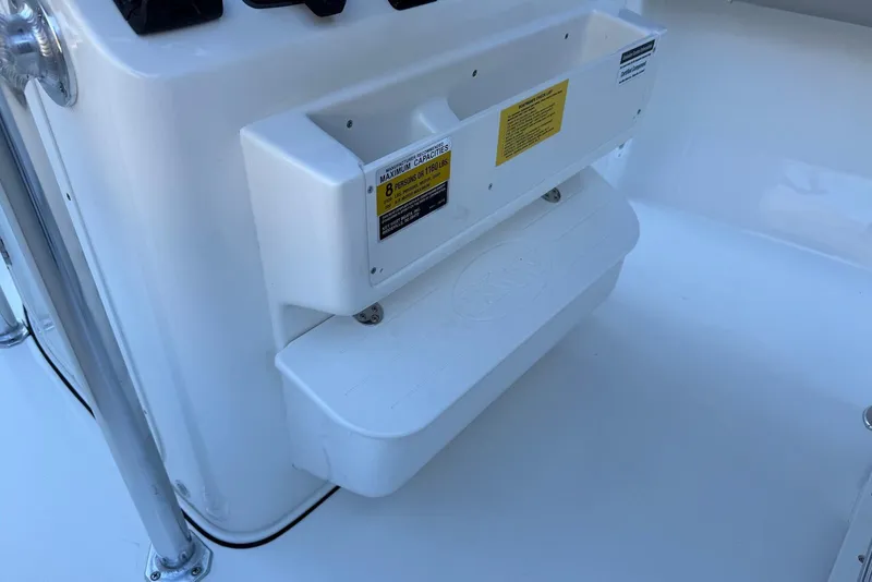 Slide: The Image of 2026 Key West 203 FS boat interior with seating and capacity label. - 19