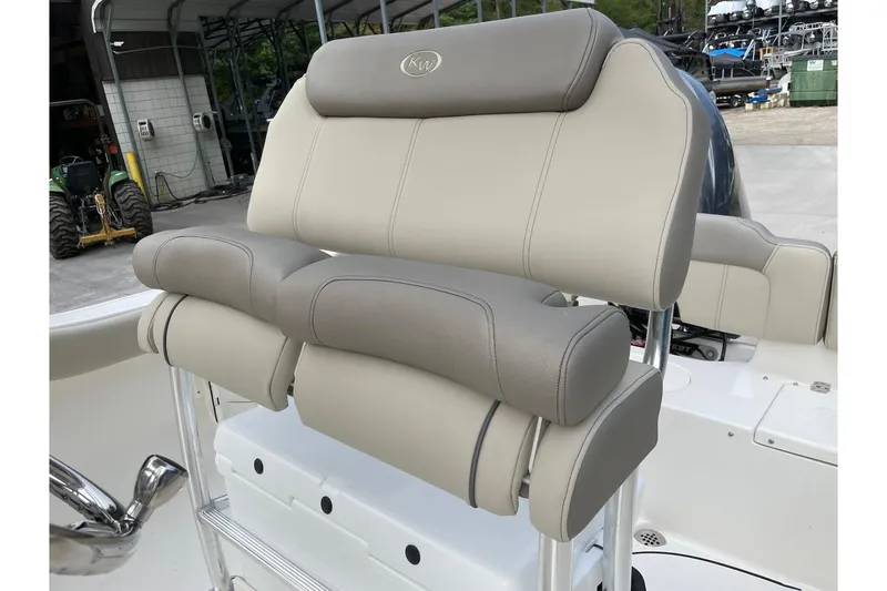 Slide: The Image of 2026 Key West 203 FS boat seat with beige upholstery and chrome accents. - 21