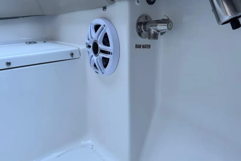 Slide: The Image of Key West 203 FS 2026 boat interior with speaker and raw water faucet. - 24