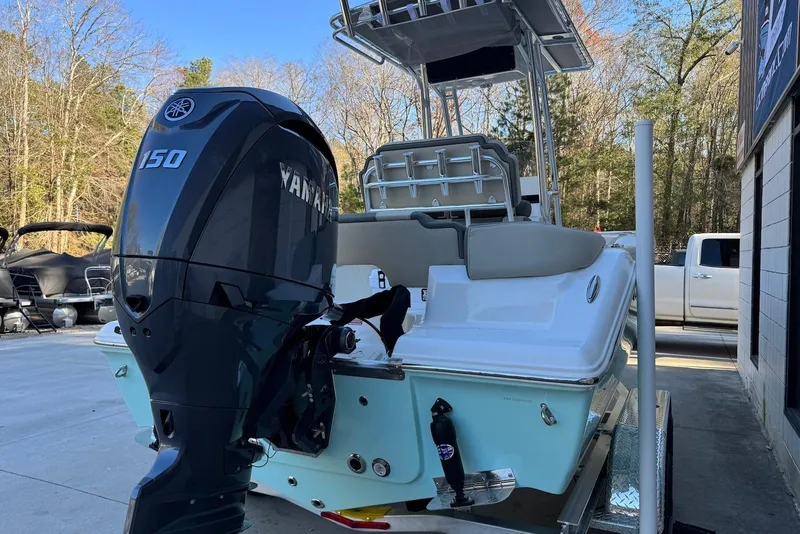 Slide: The Image of 2026 Key West 203 FS boat with Yamaha 150 engine, parked outdoors. - 4