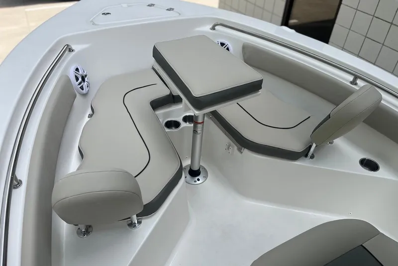 Slide: The Image of 2026 Key West 203 FS boat interior with cushioned seating and table. - 8