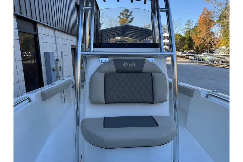 Slide: The Image of 2026 Key West 189 FS boat interior with cushioned seating and sleek design. - 10