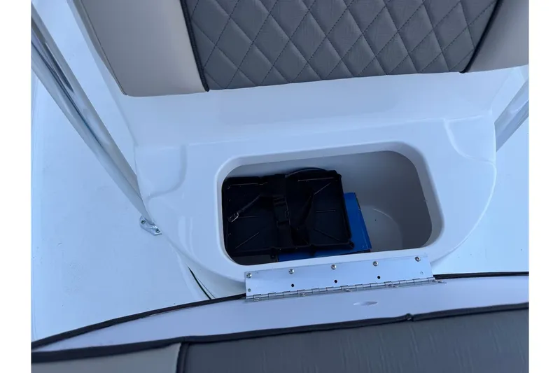Slide: The Image of Storage compartment in 2026 Key West 189 FS boat with quilted seat design. - 11