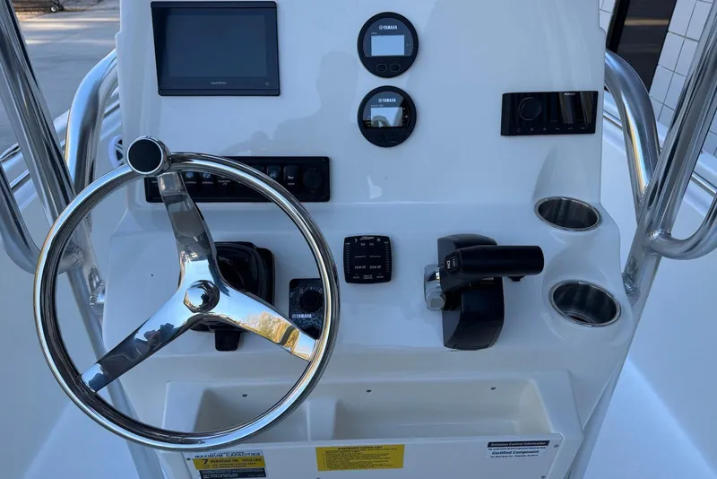 Slide: The Image of Steering console of 2026 Key West 189 FS boat with modern controls and gauges. - 14