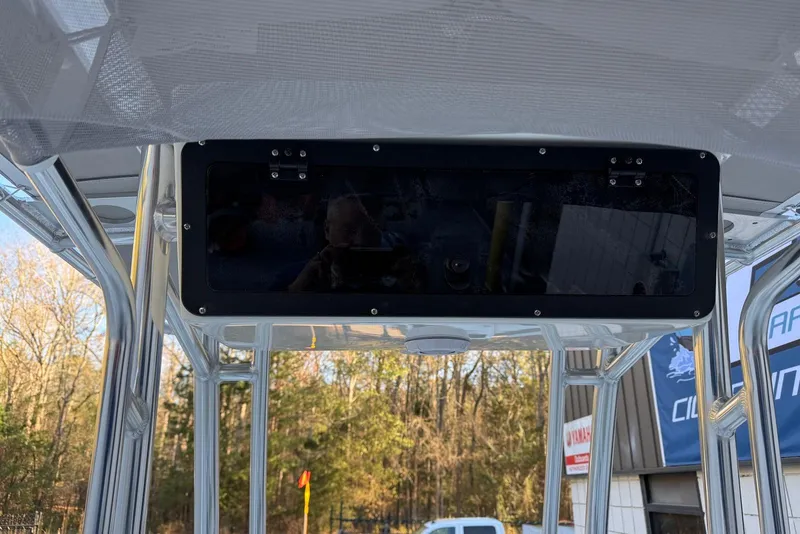 Slide: The Image of 2026 Key West 189 FS boat console with overhead storage and metal framework. - 16