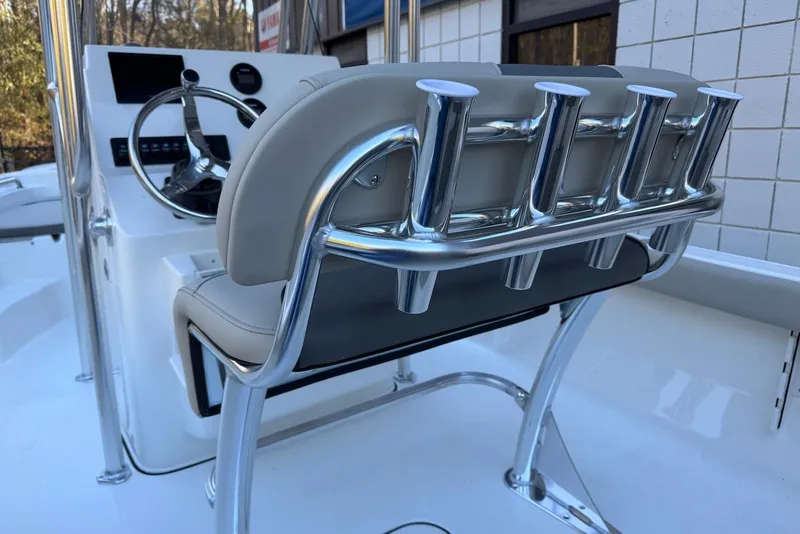 Slide: The Image of 2026 Key West 189 FS boat interior with steering console and rod holders. - 18