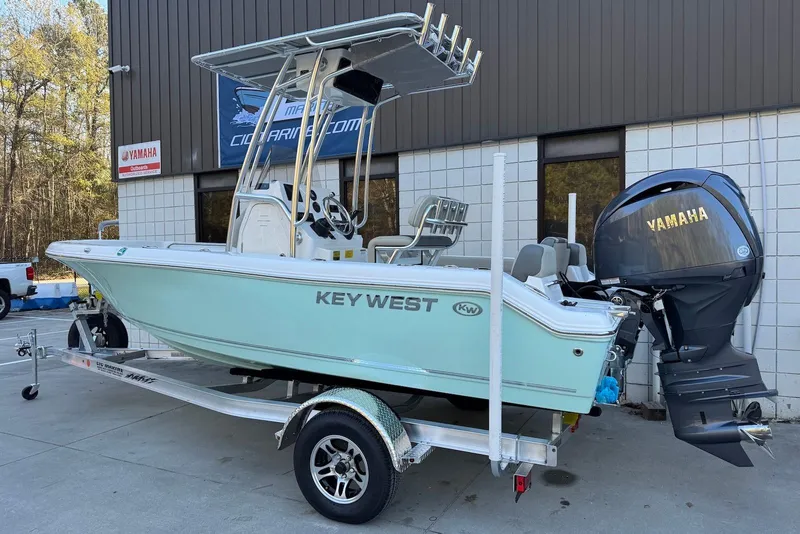 Slide: The Image of 2026 Key West 189 FS boat with Yamaha 150 engine, parked outdoors. - 3