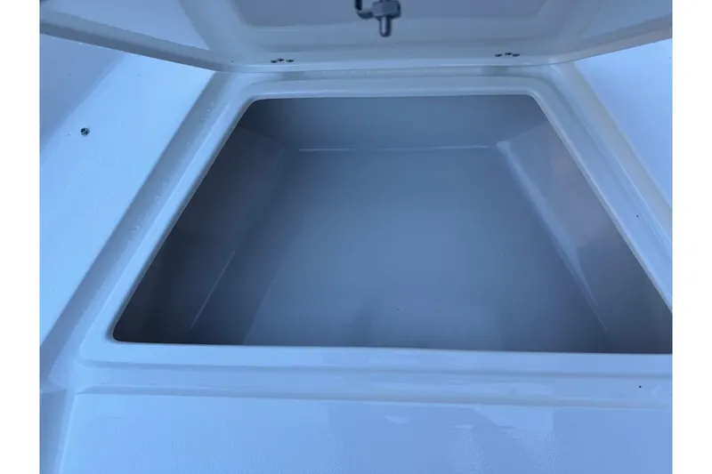 Slide: The Image of Storage compartment of 2026 Key West 189 FS boat, open and empty. - 9
