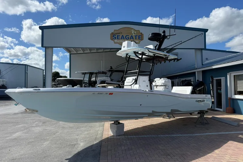 The Image of 2023 Caymas 28 HB Twin boat displayed at Seagate Marine, under a clear blue sky. - 1