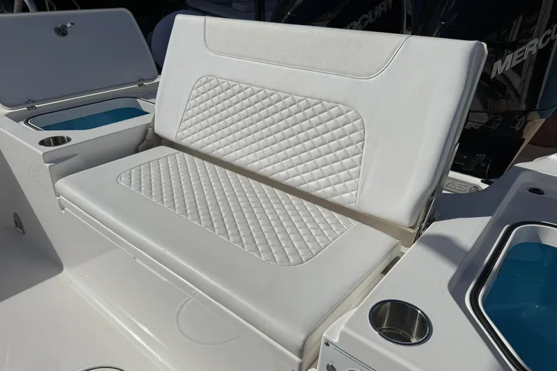Slide: The Image of 2023 Caymas 28 HB Twin boat seating with quilted upholstery and cup holders. - 21