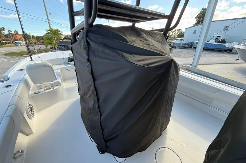 Slide: The Image of 2023 Caymas 28 HB Twin boat interior with covered console, outdoor setting. - 27