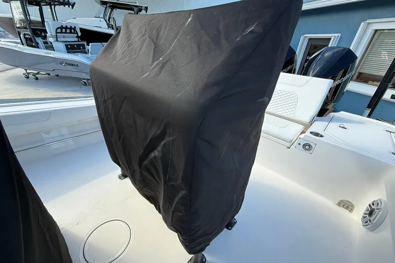 Slide: The Image of 2023 Caymas 28 HB Twin boat interior with covered console and seating area. - 29