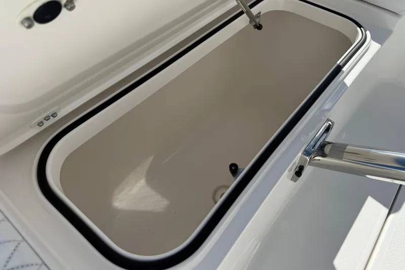 Slide: The Image of Open storage compartment on 2023 Caymas 28 HB Twin boat, showcasing interior space. - 38