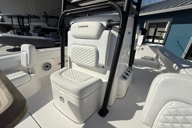Slide: The Image of 2023 Caymas 28 HB Twin boat interior with white cushioned seating and sleek design. - 44