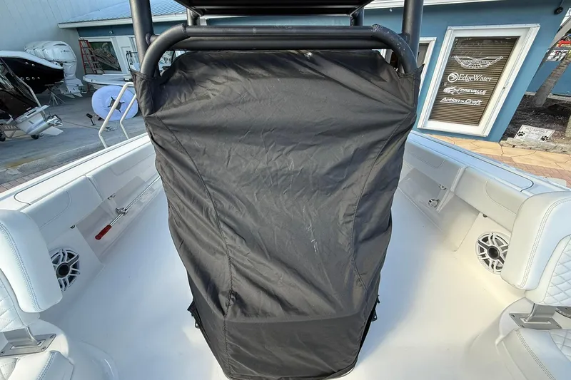 Slide: The Image of 2023 Caymas 28 HB Twin boat interior with covered console and white seating. - 45