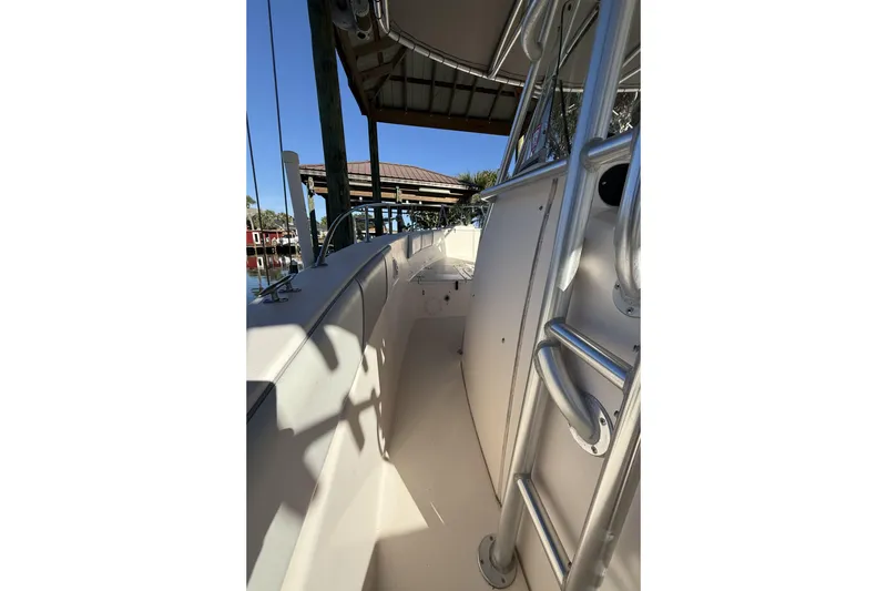 Slide: The Image of 2005 Grady-White Bimini 306 boat interior with metal railings and seating. - 11