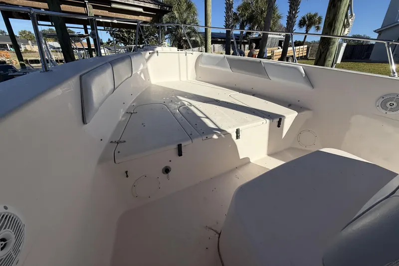 Slide: The Image of 2005 Grady-White Bimini 306 boat interior with seating and storage compartments. - 19