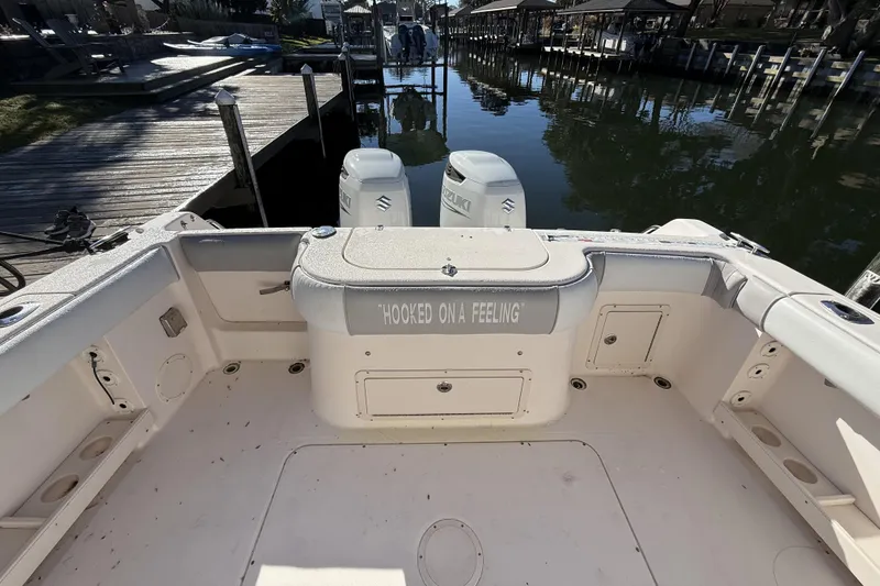Slide: The Image of 2005 Grady-White Bimini 306 boat interior with "Hooked on a Feeling" text. - 22