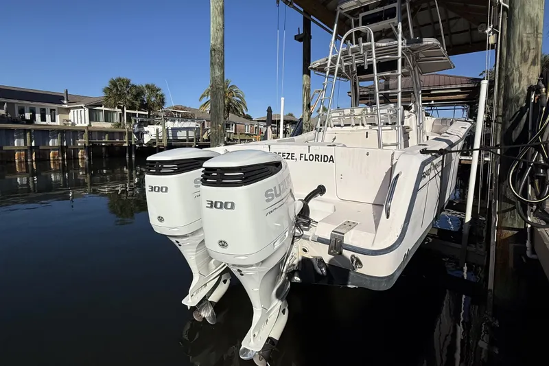 Slide: The Image of 2005 Grady-White Bimini 306 boat with dual 300 horsepower engines docked in Florida. - 3