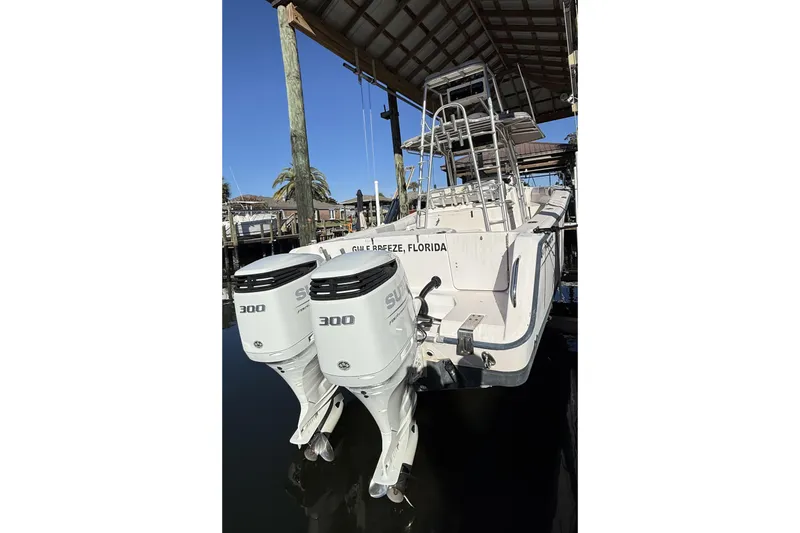 Slide: The Image of 2005 Grady-White Bimini 306 boat with dual 300 horsepower engines, docked in Florida. - 4