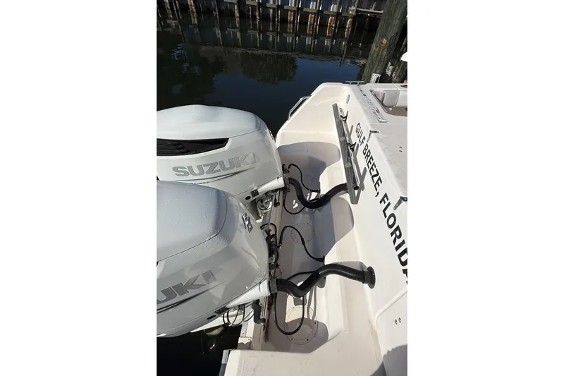 Slide: The Image of 2005 Grady-White Bimini 306 with dual Suzuki outboard motors, docked in Gulf Breeze, Florida. - 5