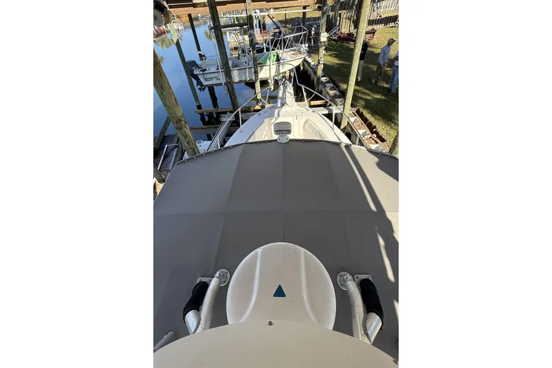 Slide: The Image of 2005 Grady-White Bimini 306 boat docked, viewed from above, with surrounding marina. - 9