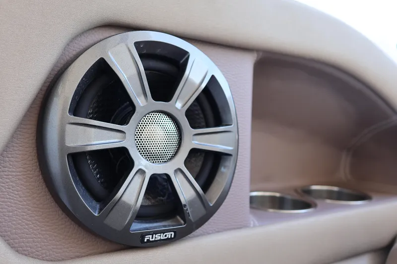 Slide: The Image of Speaker system in 2018 Regal 28 Express boat interior, featuring Fusion audio. - 16