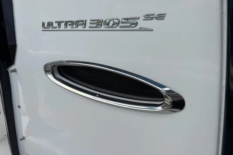Slide: The Image of 2024 Sea Hunt Ultra 305 SE boat emblem and chrome detail. - 15