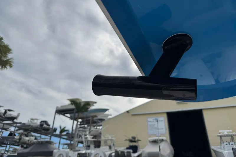 Slide: The Image of 2024 Sea Hunt Ultra 305 SE boat detail with marina background. - 17