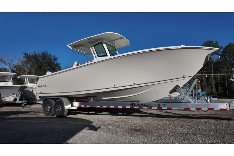 The Image of 2026 Sailfish 272 SE boat on trailer, displayed outdoors under clear blue sky. - 0