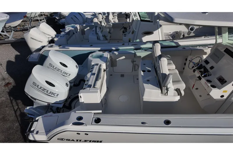Slide: The Image of 2026 Sailfish 272 SE boat with dual Suzuki outboard engines, spacious cockpit, and modern helm. - 11