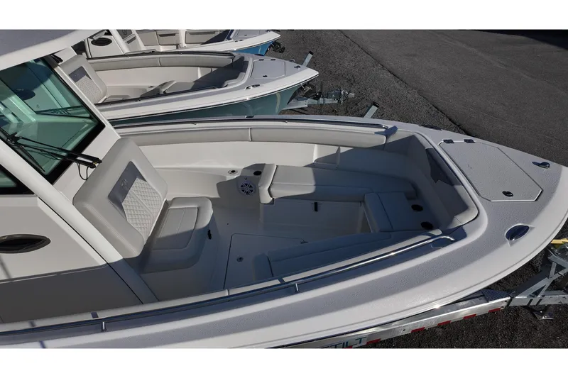 Slide: The Image of 2026 Sailfish 272 SE boat interior with cushioned seating and sleek design. - 13