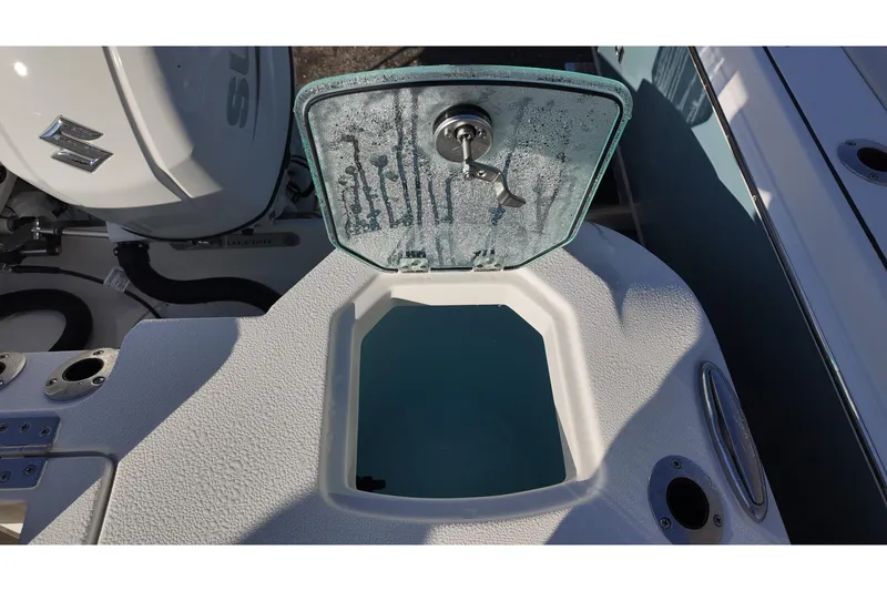 Slide: The Image of Open hatch on 2026 Sailfish 272 SE boat, showing interior compartment. - 15