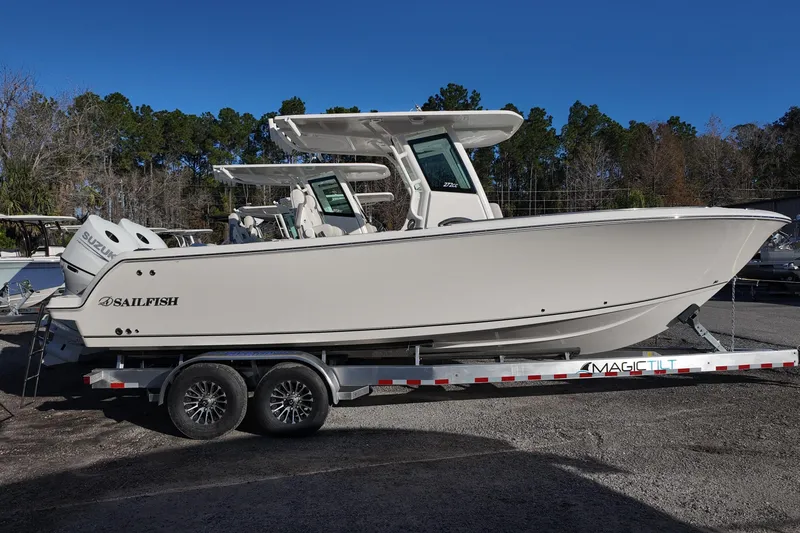 Slide: The Image of 2026 Sailfish 272 SE boat with dual Suzuki engines on a trailer. - 2