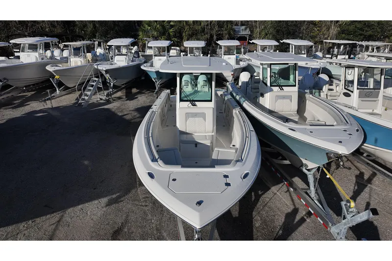 Slide: The Image of 2026 Sailfish 272 SE boat with dual engines, spacious deck, and modern design. - 4