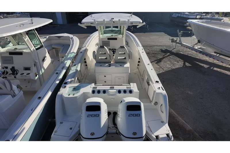 Slide: The Image of 2026 Sailfish 272 SE boat with dual Suzuki engines, featuring a spacious deck and modern controls. - 5