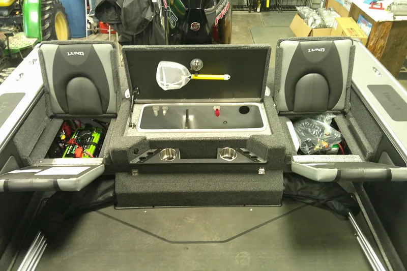 Slide: The Image of Interior of 2025 Lund 1975 Pro-V boat with storage compartments and seating. - 11