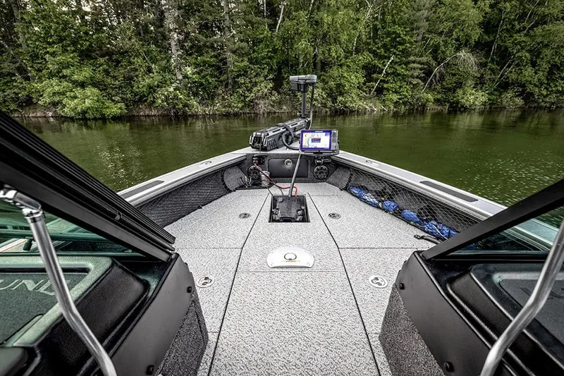 Slide: The Image of Manufacturer Provided Image: 2025 Lund 1975 Pro-V boat interior with advanced navigation system on a serene lake. - 17
