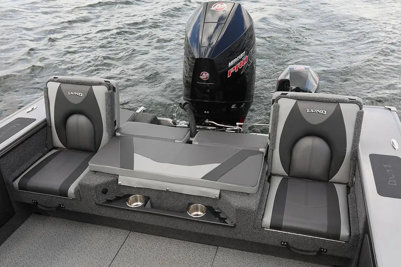 Slide: The Image of Manufacturer Provided Image: 2025 Lund 1975 Pro-V boat interior with seating and motor on water. - 19