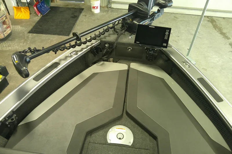 Slide: The Image of Interior of a 2025 Lund 1975 Pro-V boat with advanced navigation equipment. - 5