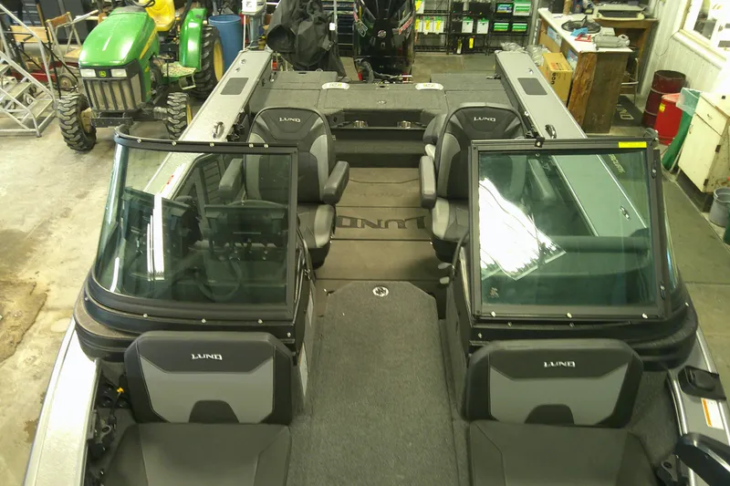 Slide: The Image of 2025 Lund 1975 Pro-V boat interior in a workshop setting. - 6