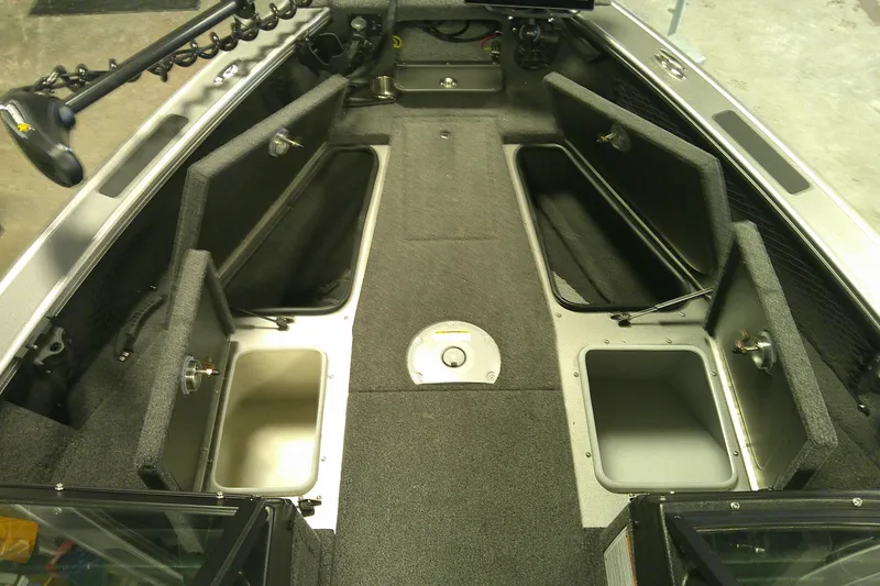 Slide: The Image of 2025 Lund 1975 Pro-V boat interior with open storage compartments and modern design. - 7