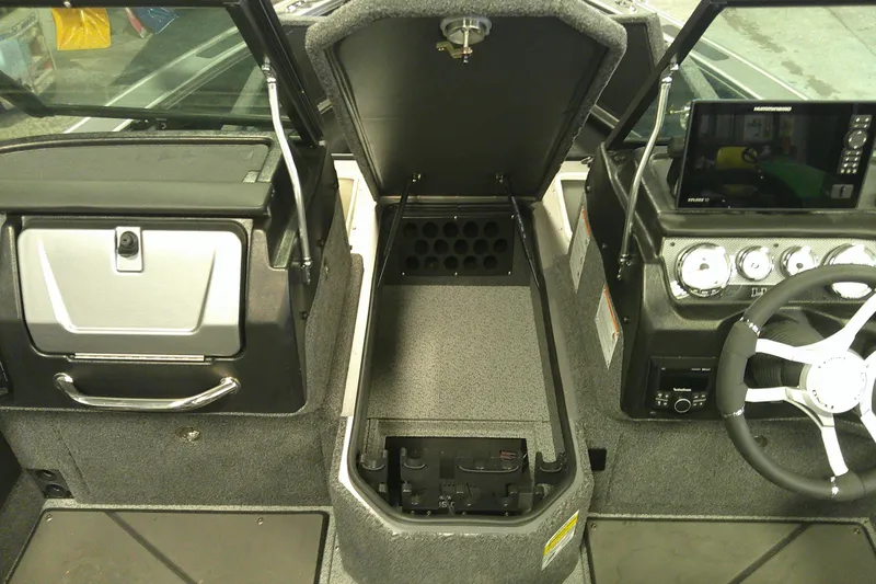 Slide: The Image of Interior of 2025 Lund 1975 Pro-V boat with storage and control panel. - 8