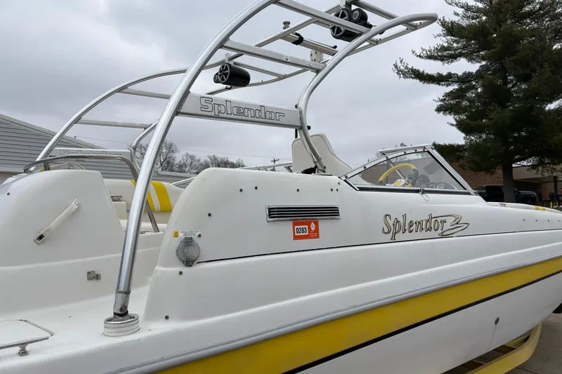 Slide: The Image of 2003 Splendor 240 Platinum boat with yellow accents and sleek design. - 35