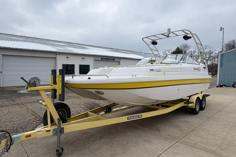 Slide: The Image of 2003 Splendor 240 Platinum boat on trailer outside showroom, overcast sky. - 6