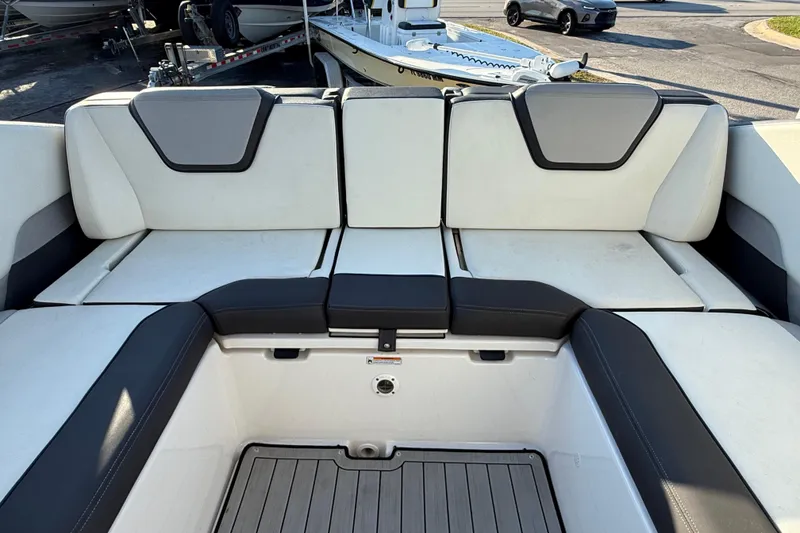 Slide: The Image of 2021 Yamaha Boats 252S interior seating with sleek design and comfortable upholstery. - 15