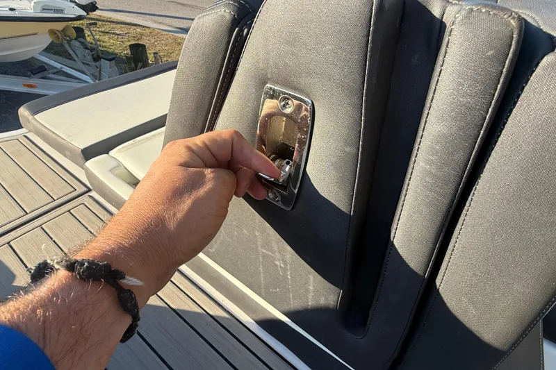 Slide: The Image of Hand opening seat compartment on 2021 Yamaha Boats 252S. - 20